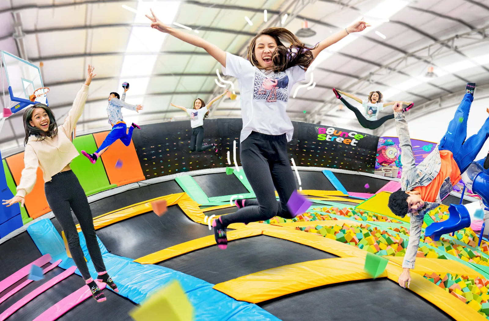 Children and teenagers mid-jump on the trampolines at Bounce Street Asia