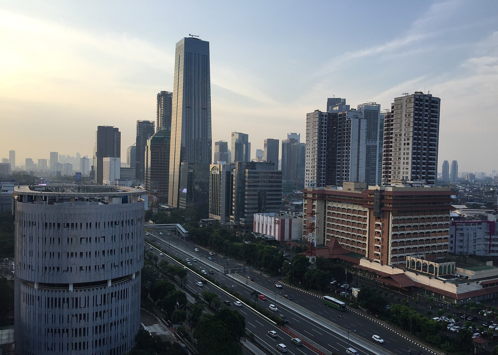 Cars on Jalan Gatot Subroto in South Jakarta, with the city skyline visible in the background
